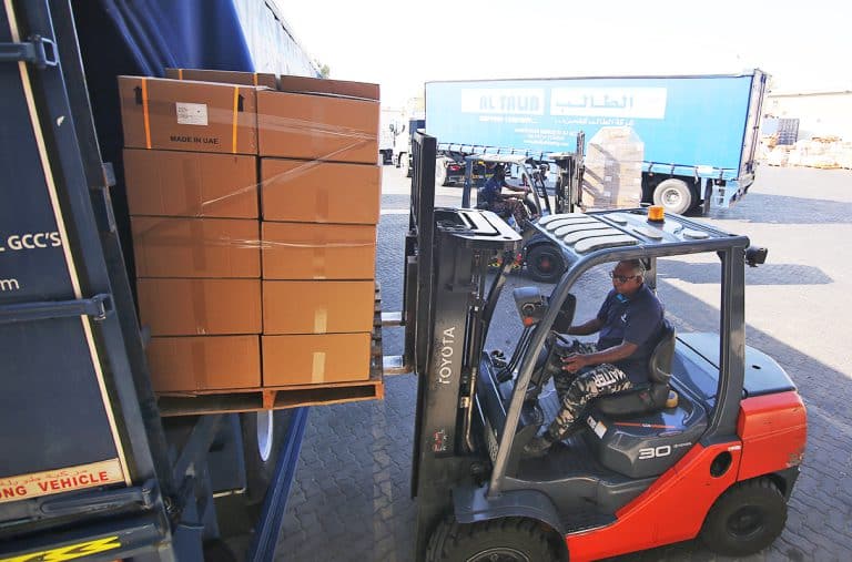 Forklift loading a pallet in Al Talib Shipping Company box truck