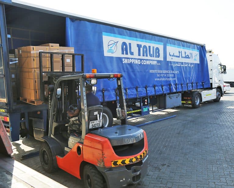 Al Talib trailer truck being loaded by a forklift