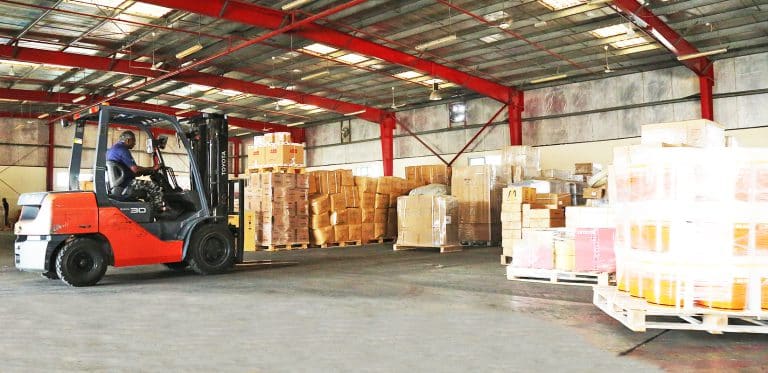 Arranging cargo pallets at Al Talib freight forwarders warehouse Dubai