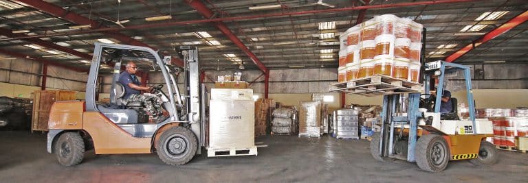 Cargo operations inside Al Talib shipping Company warehouse in Dubai