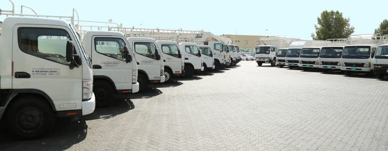Land cargo trucks lined up in front of Al Talib office in Dubai