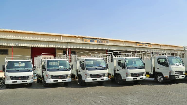 Trucks of Al Talib shipping Company waiting for cargo loading