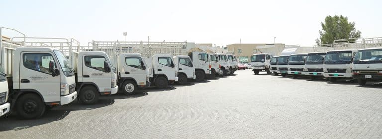 Land cargo trucks lined up in front of Al Talib office
