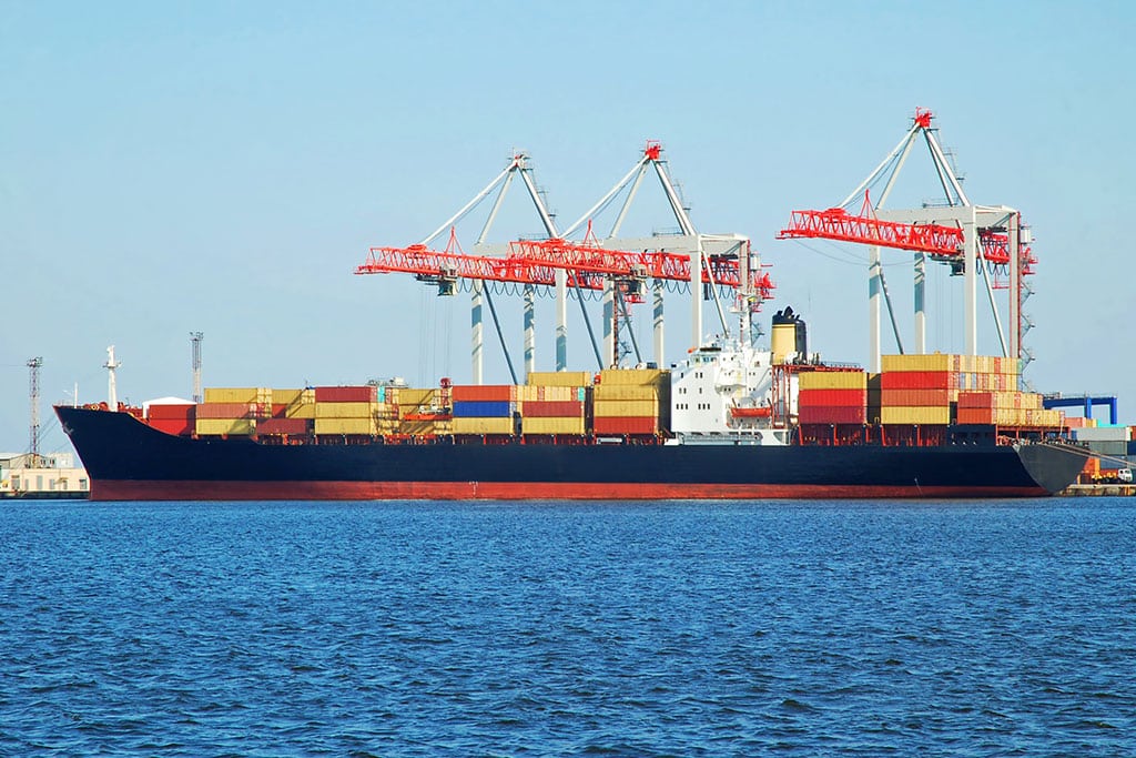 Ship being loaded with containers with industrial cargo from Al Talib Shipping Company