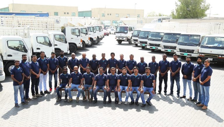 Al Talib Shipping Company trucking fleet with senior officers